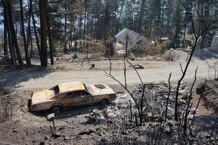 FILE PHOTO - An old hot rod was among the property destroyed by the White Rock Lake wildfire in the North Westside community.