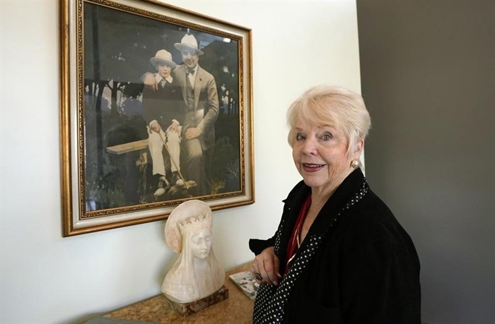 Diane Capone discusses her family near a photograph of her father, Albert 