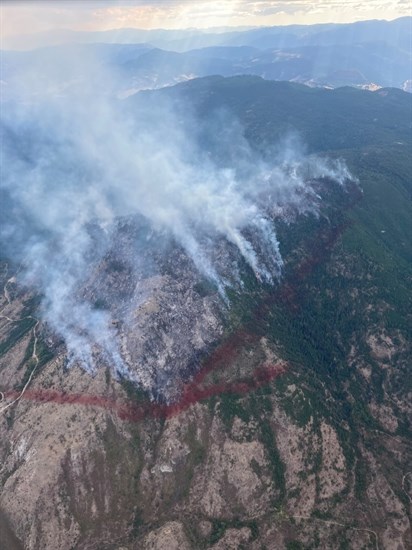 Retardant lines are used to set a perimeter on the Skaha Creek wildfire.