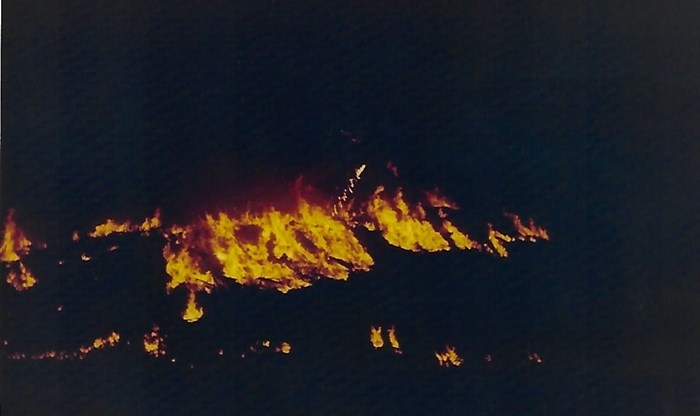 Visual of the fire drip using the method of the time, where the napalm drips and is ignited by torch to do controlled burns.