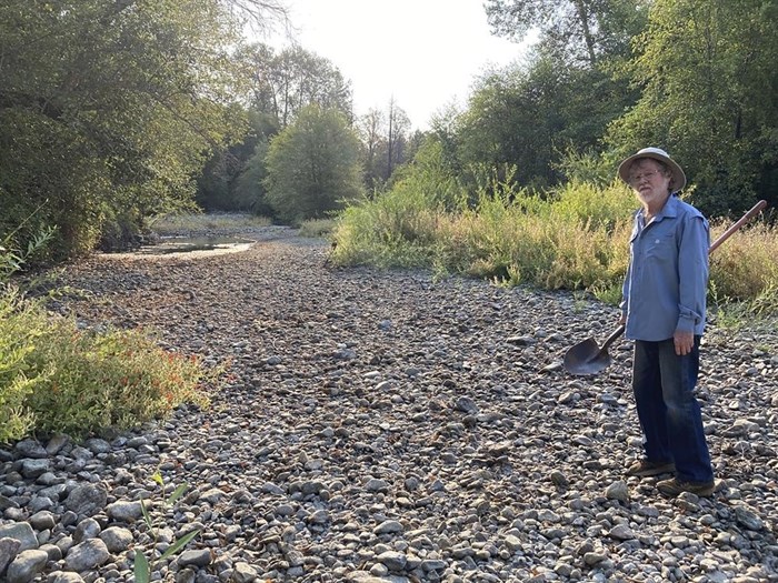 Jack Dwyer stands on the dry creek bed of Deer Creek in Selma, Ore. on Thursday, Sept. 2, 2021.