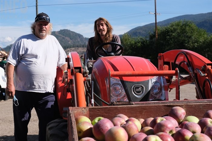 Gatzke Orchard owner Alan Gatzke with orchard worker Danny Kiatipis, Thursday, Sept. 23, 2021.