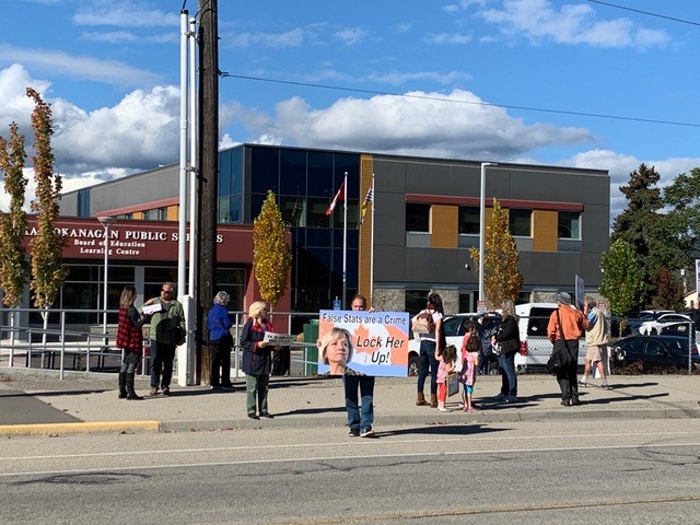 A small protest was held outside the Central Okanagan school district office on Hollywood Road in Kelowna, Wednesday, Oct. 6, 2021.