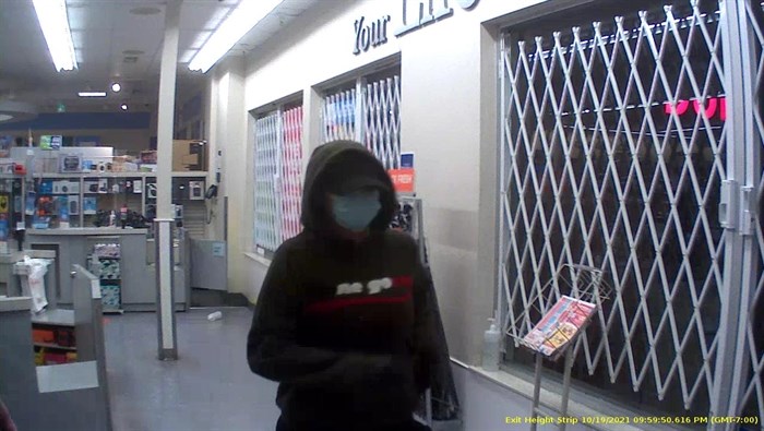 Penticton RCMP have releases images from surveillance video of two suspects wanted for a robbery, Tuesday, Oct. 20, 2021, at the Shoppers Drug Mart on Main Street. This is the female suspect.