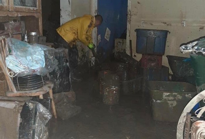 An Endeavor to be Better team member cleans flood damaged home in Merritt.