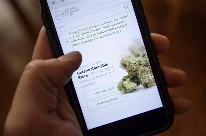 A Ontario Cannabis Store website pictured on a mobile phone, in Ottawa, Thursday, Oct. 18, 2018.&nbsp;Ontario’s cannabis regulator is taking aim at licensed pot shops it's found selling unregulated products. 