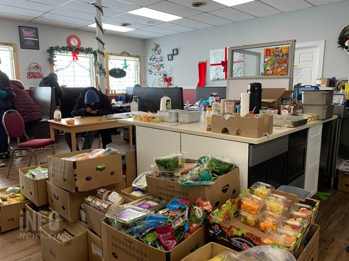 Produce from Fresh Street Market sits at The Loop on Dec. 29, 2021, as volunteers work to prepare more food for their clients, while finding space to store the rest.