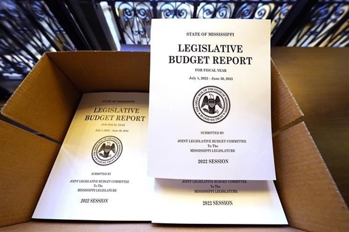 A box of Legislative Budget Reports for the 2023 fiscal year await distribution at the Capitol in Jackson, Miss., Monday, Jan. 3, 2022. Lawmakers begin the latest legislative session on Tuesday, at noon.