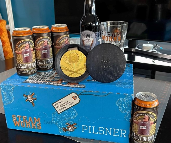 A 24-pack of Pilsner from Steamworks Brewing with Greg Stewart's photo on the labels. 