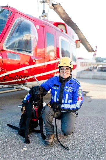 Black lab Chase and his handler Terry Downs.