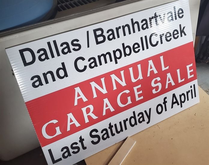 Some community garage sales are returning this spring. Sign for an upcoming sale in Kamloops.