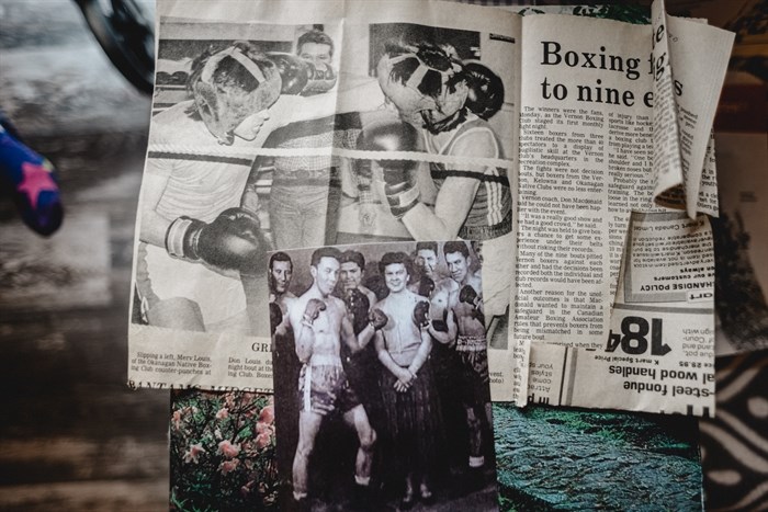 The bottom photo shows Wally Louis (left), Delores Marchand (middle), and Freddy Louis (right) in the 1950’s, as they pose for a boxing photo. The newspaper clipping above shows Freddy Louis standing behind two players as he referees a boxing match.