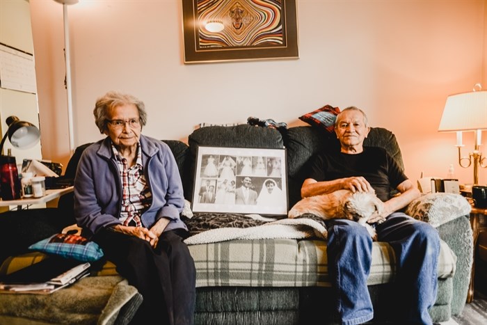 Edna and Fred Louis sit in their living room and reminisce about meeting each other through dances and baseball as youth.