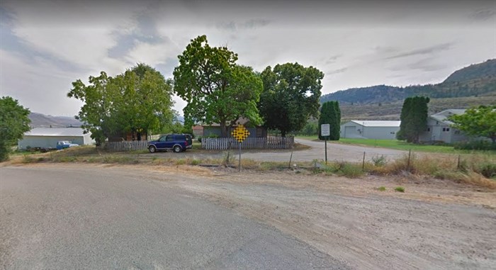 A shabby fence separates Canada and the United States in Osoyoos. Photo taken from the Canadian side.