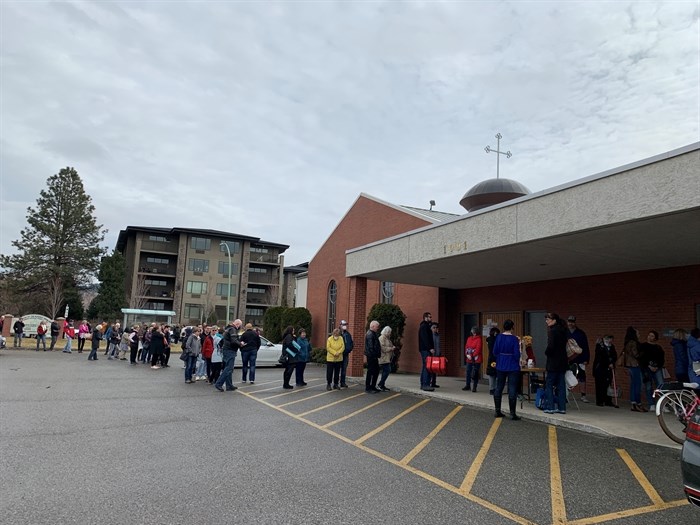 A fundraiser at the Ukrainian Catholic Church saw more than 100 people line up outside of the building, March 12, 2022.