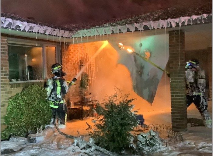 West Kelowna Fire Rescue firefighter fight a house fire in the 2400 block of Thacker Drive, Tuesday, March 22, 2022.