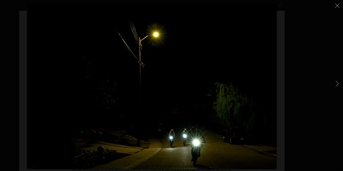 Serious cyclists ride through the night.