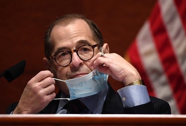 FILE PHOTO - House Judiciary Committee Chairman Jerry Nadler, D-N.Y., adjusts his face mask during a House Judiciary Committee markup of the Justice in Policing Act of 2020 on Capitol Hill in Washington, Wednesday, June 17, 2020. 