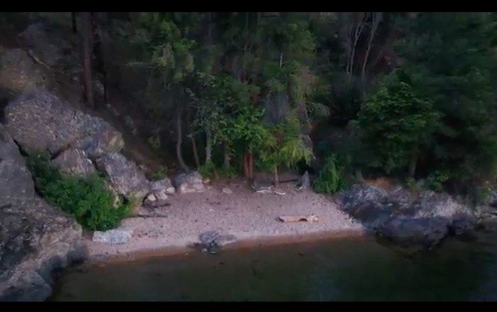 This drone shot shows one of the sandy beaches on the property.