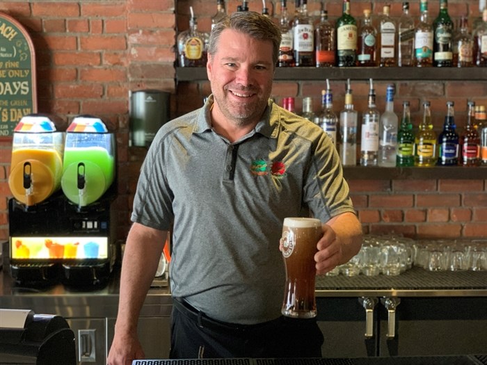 General manager Warren Baker of the Kamloops Kelly O’Bryan's location offers at beer at the restaurant.