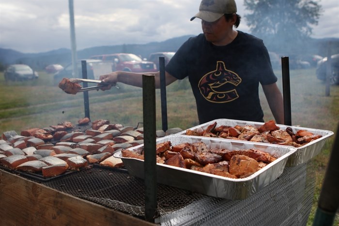 Using alder wood and a smoke pit, OKIB member Justin Joe prepared over 500 smoked salmons for the community dinner that was hosted at the Okanagan Indian Band’s grand reopening of its Cultural Arbor on May 28.