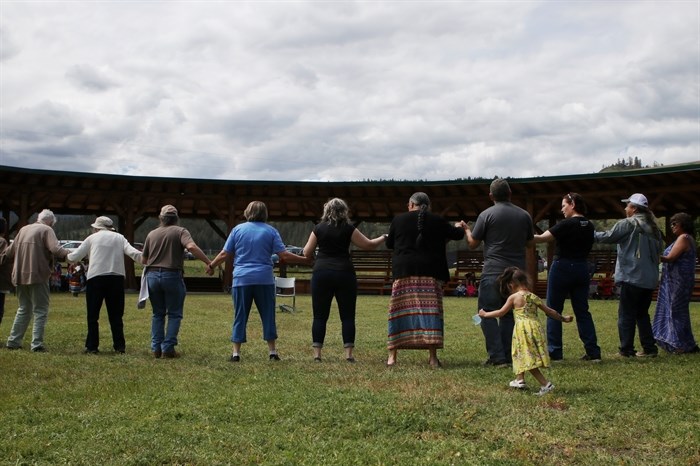 Elders participate in a Round Dance during the Okanagan Indian Band’s grand reopening of its Cultural Arbor on May 28. 