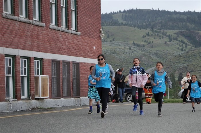 A group of syilx Youth kick off the 14th annual Spirit of syilx Youth Unity Run outside of the Kamloops Indian Residential “School” in Secwepemc territory on June 3, 2022.