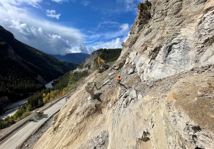 Scaling the rocky cliffs is all in a day's work for the construction crews at the Kicking Horse Canyon project on the Trans-Canada east of Golden.