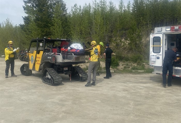 Central Okanagan Search and Rescue volunteers prepare to load a cyclist rescued on the KVR rail trail in the Myra Canyon onto an ambulance, Wednesday, June 9, 2022.
