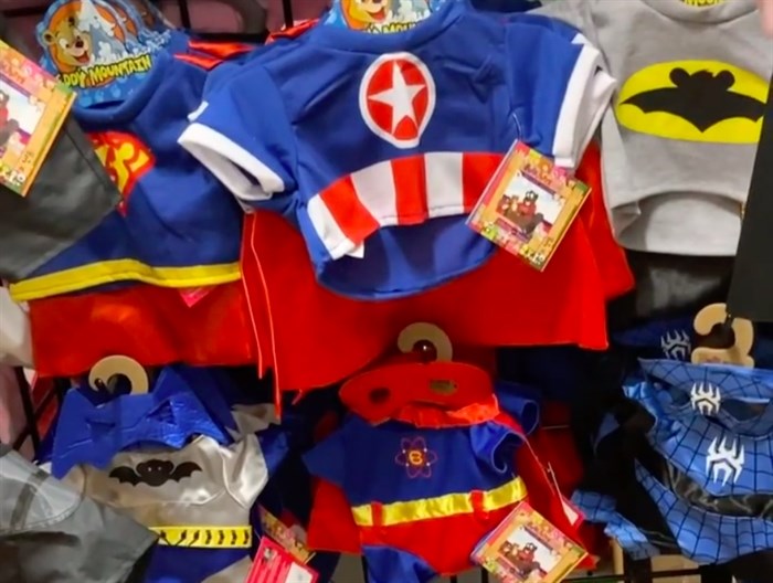 Superhero costumes are among the outfits that come in teddy bear sizes at Build a Furry Friend in West Kelowna.