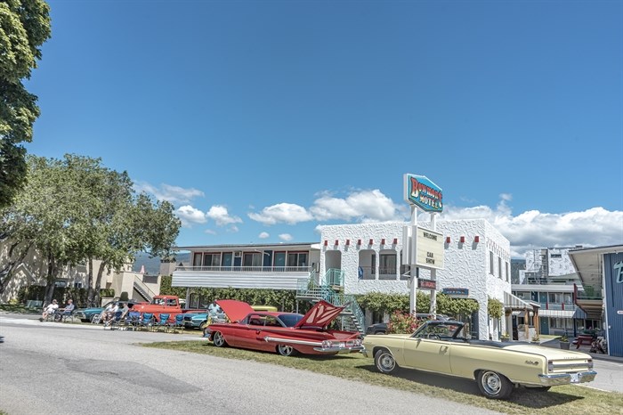 Car enthusiasts have spilled over onto the Bowmont Hotel in Penticton during the 2022 Peach City Beach Cruise. 