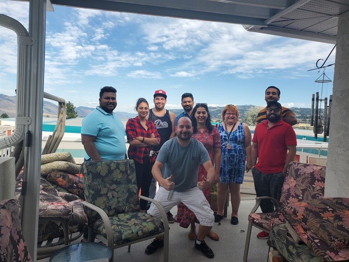 Employees at the first Mitchie's Delivery staff meeting with original owner Mitch Hughes front and center, August 2019.
