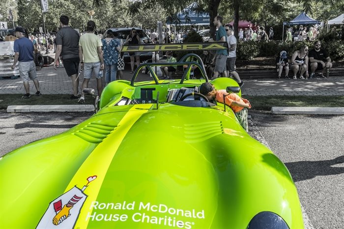 5-year-old Zoltan Kaman takes a good look at this bright green roadster.