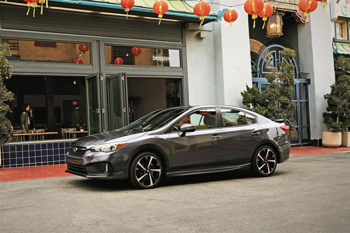 This photo provided by Subaru shows the 2022 Subaru Impreza, a compact sedan or hatchback that offers one of the least expensive entry points into an all-wheel-drive vehicle. 