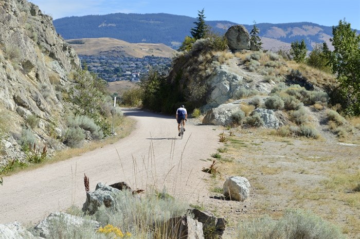 FILE PHOTO - A cyclist is seen riding on the north end of the Okanagan Rail Trail toward Vernon, Aug. 14, 2022.
