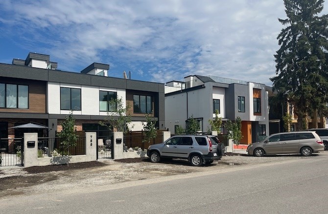 These are two finished fourplexes on Glenwood Avenue in Kelowna. Another is under construction on the right side while a single-family house remains, for now, on the left.