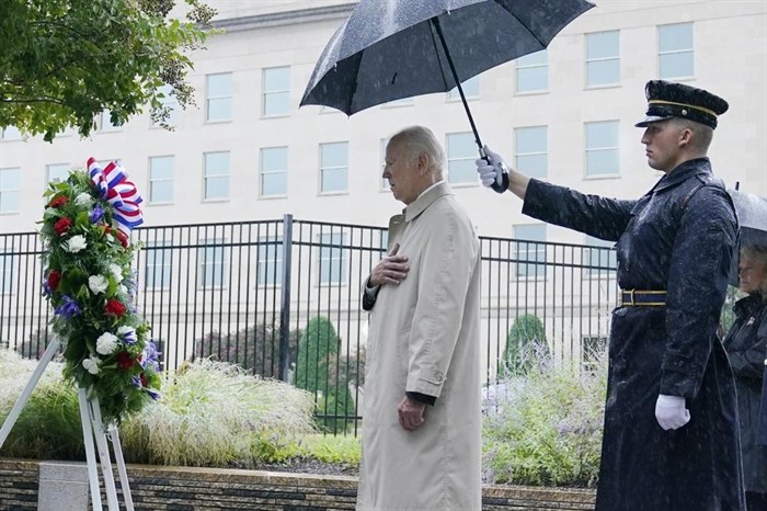 President Joe Biden participates in a wreath laying ceremony while visiting the Pentagon in Washington, Sunday, Sept. 11, 2022, to honor and remember the victims of the September 11th terror attack.
