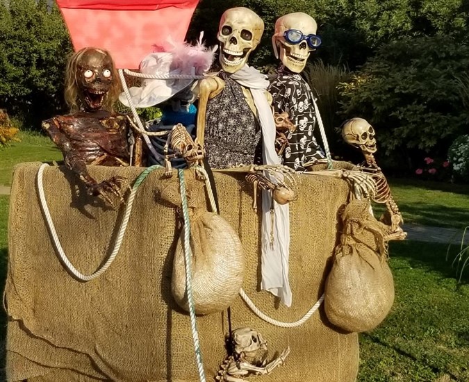 A family of skeletons owned by Summerland resident Heather Pescada in an air balloon basket on her property in Trout Creek on Oct. 1, 2022.