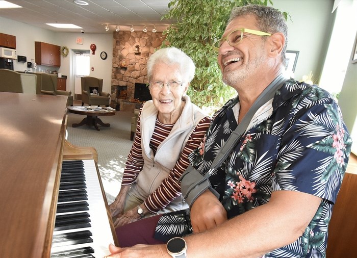 General manager Vic Klassen and resident Verla McClynch of The Hamlets at Penticton play a tune on their grand piano that will now be replaced.