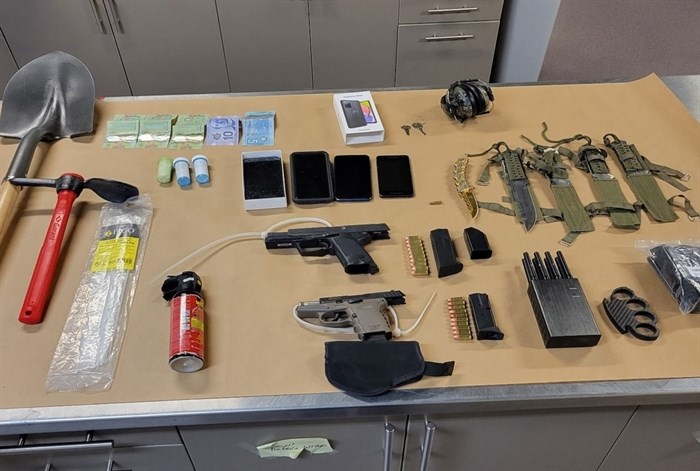 Weapons and other items seized by police during an arrest in Kelowna, Oct. 9, 2022.