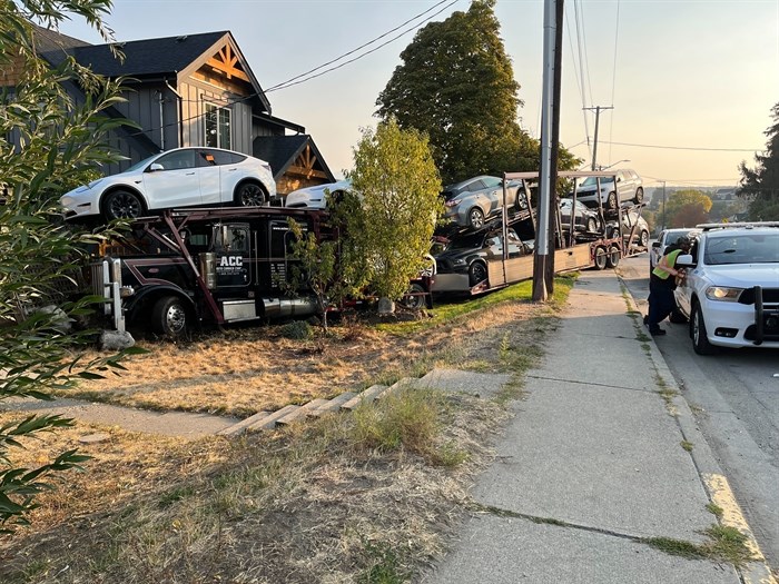 A semi loaded with vehicles left the road and crashed into the front yard of a home in Kamloops early this morning, Oct. 18, 2022.