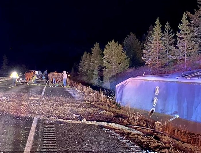 Bystanders helping after a fatal collision on the Coquihalla highway, Oct. 22.
