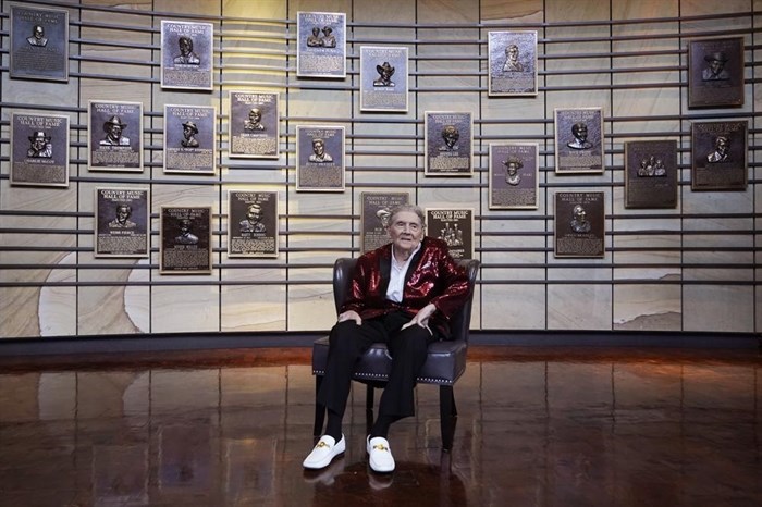 FILE - Jerry Lee Lewis sits for a picture at the Country Music Hall of Fame after it was announced he will be inducted as a member on May 17, 2022, in Nashville, Tenn. Spokesperson Zach Furman said Lewis died Friday morning, Oct. 28, 2022, at his home in Memphis, Tenn. He was 87.