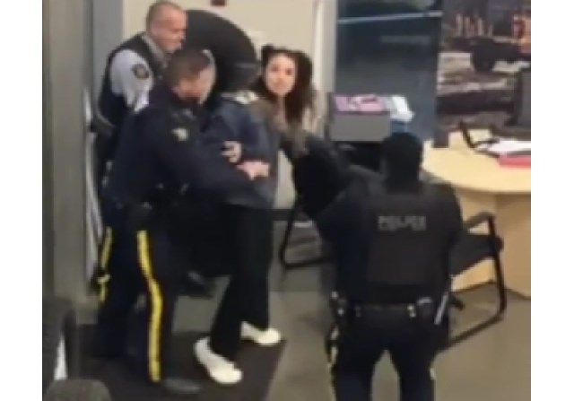 A woman was arrested at a Kamloops automotive dealership earlier this week while live-streaming the incident.