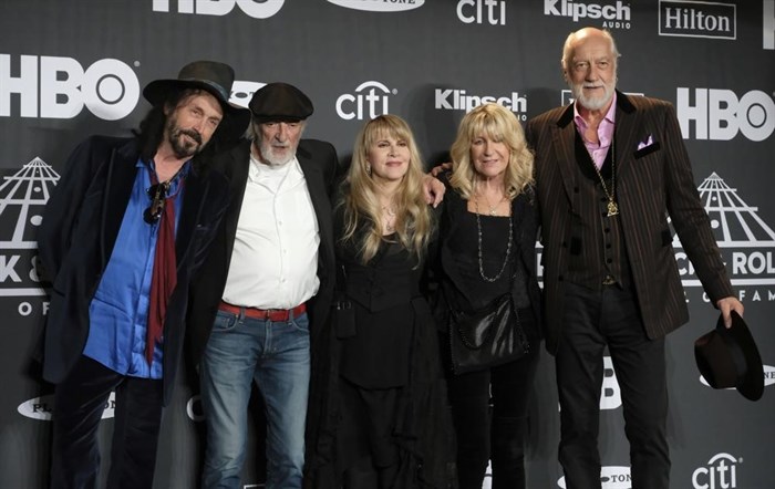 FILE - Members of Fleetwood Mac, from left, Mike Campbell, John McVie, Stevie Nicks, Christine McVie and Mick Fleetwood appear at the Rock & Roll Hall of Fame induction ceremony in New York on March 29, 2019.