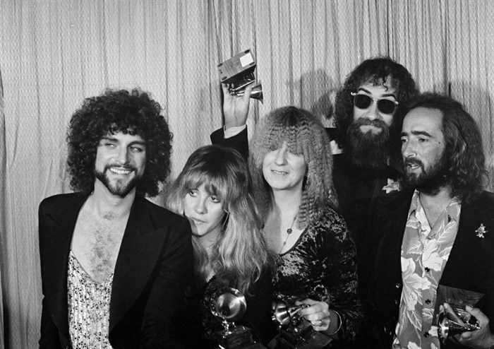 FILE - Members of the rock group Fleetwood Mac, from left, Lindsey Buckingham, Stevie Nicks, Christine McVie, Mick Fleetwood, and John McVie pose with their Album of the Year Grammy Award for 