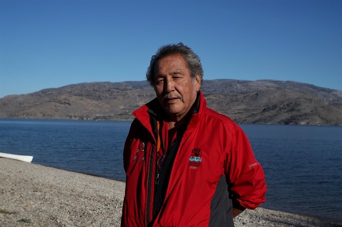 Wilfred “Grouse” Barnes, a syilx Elder and knowledge keeper from Westbank First Nation, stands at the shore of Okanagan Lake in syilx homelands on Sept. 25, 2022. 