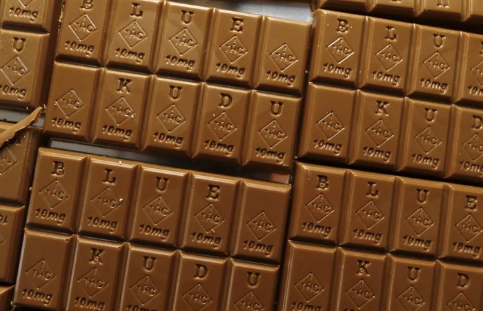 Candy bars marked with Colorado's new required diamond-shaped stamp noting that the product contains marijuana, are displayed in Denver on Monday, Sept. 19, 2016. State officials require the stamp to be put directly on edibles after complaints that the treats look too much like their non-intoxicating counterparts.