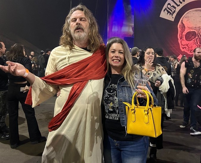An unidentified man dressed as Jesus at a heavy metal concert in Penticton with concert goer Tricia Twombly. 