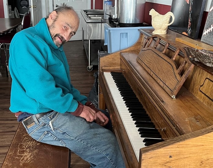 Bryan Rabie plays piano at The Loop homeless support shelter in Kamloops. 